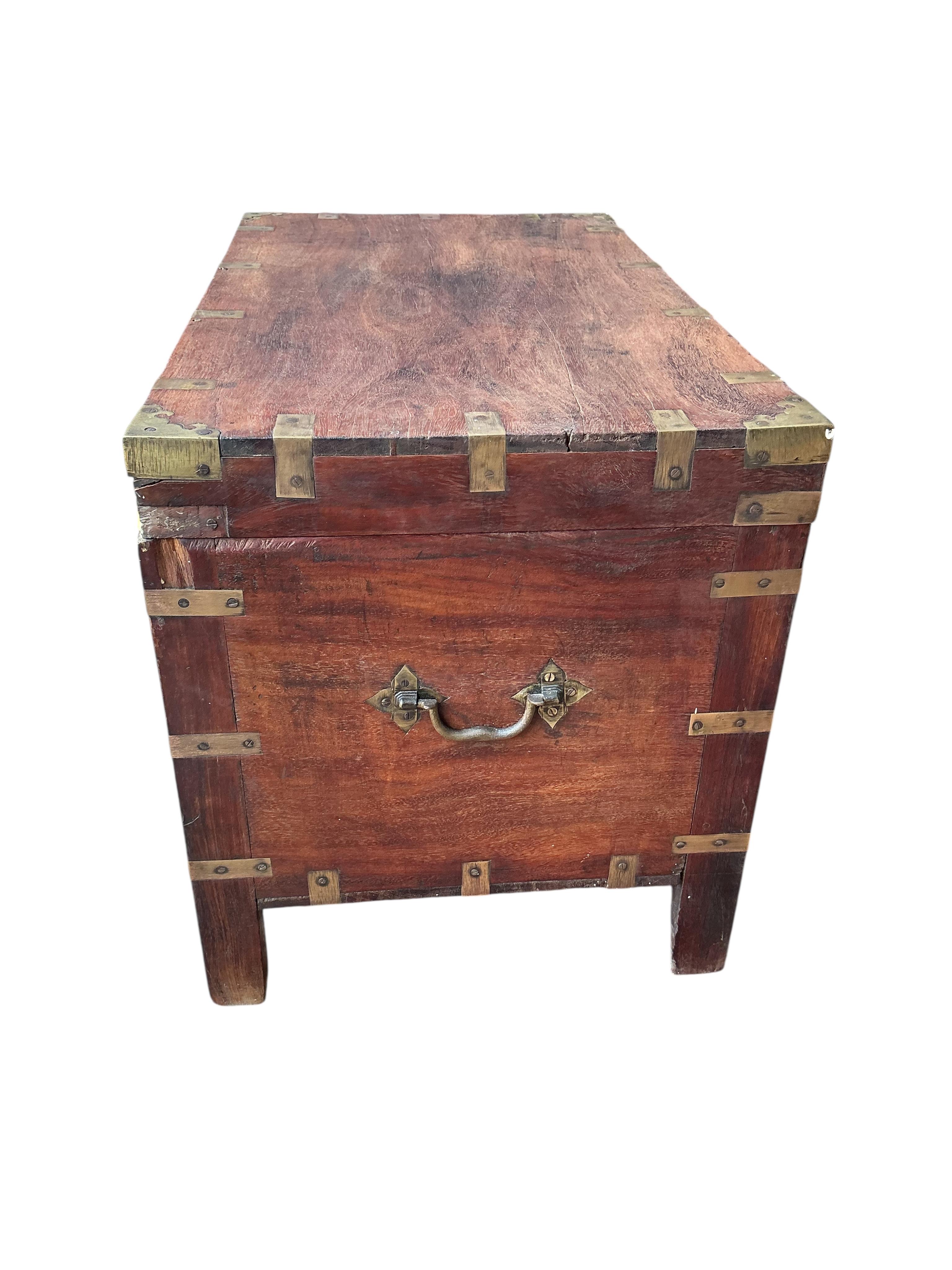 A brass mounted rectangular hardwood trunk, width 72cm, depth 42cm, height 49cm